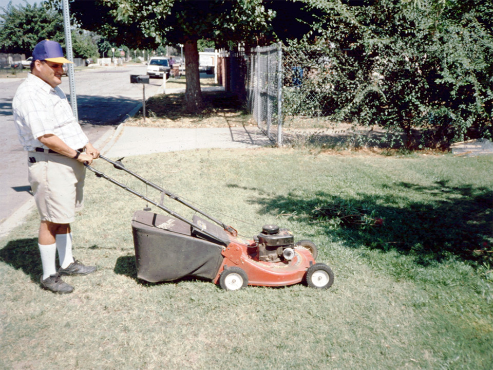 Jose mowing a lawn in 1996